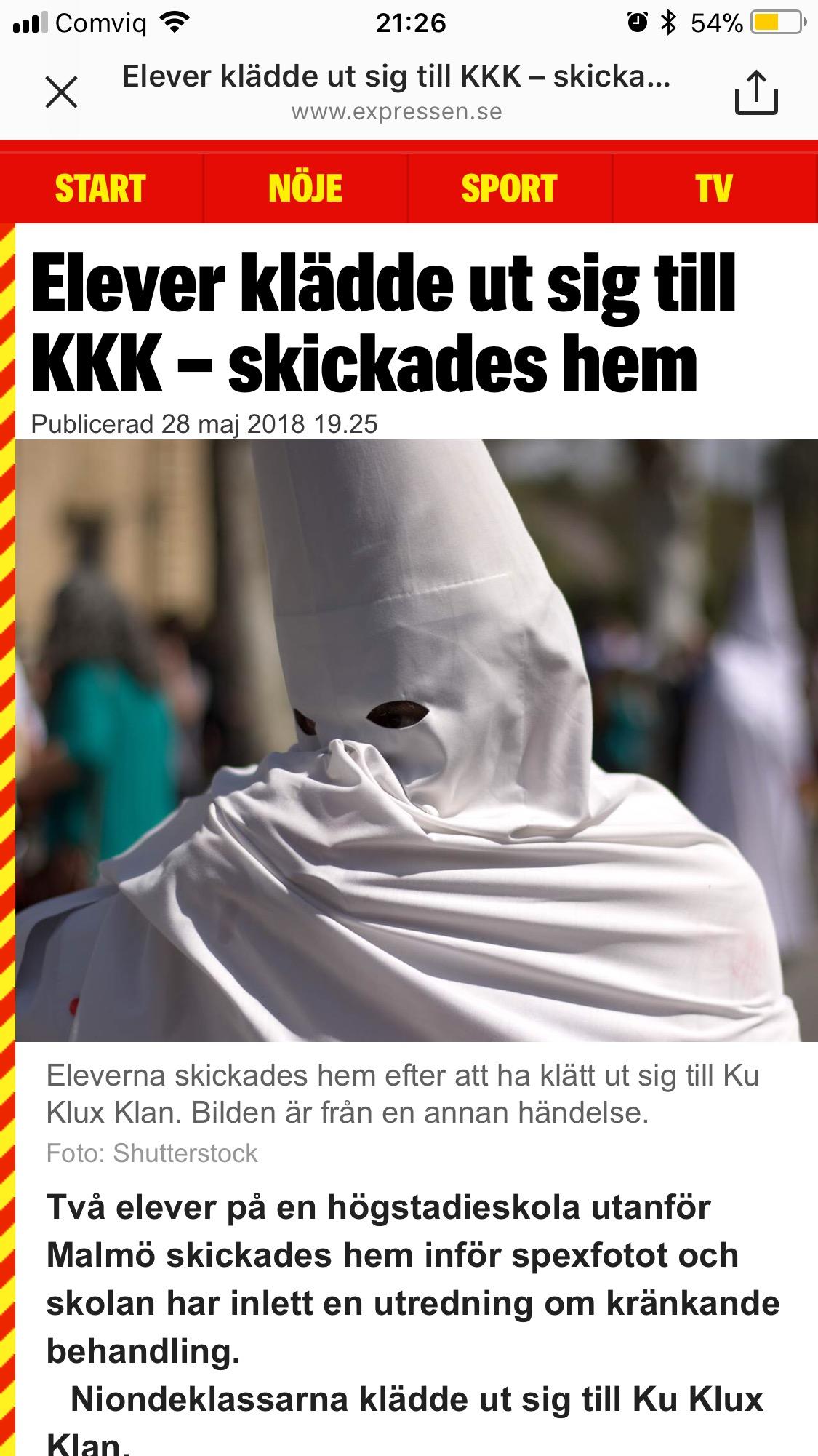 Image of Children in Ku Klux Klan costumes pose with Ku Klux