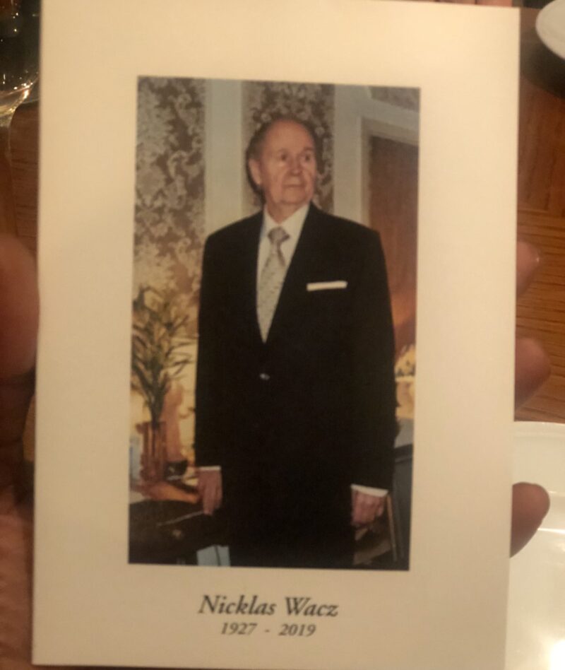 a hand holding a card with a picture of a man Nicklas Wacz